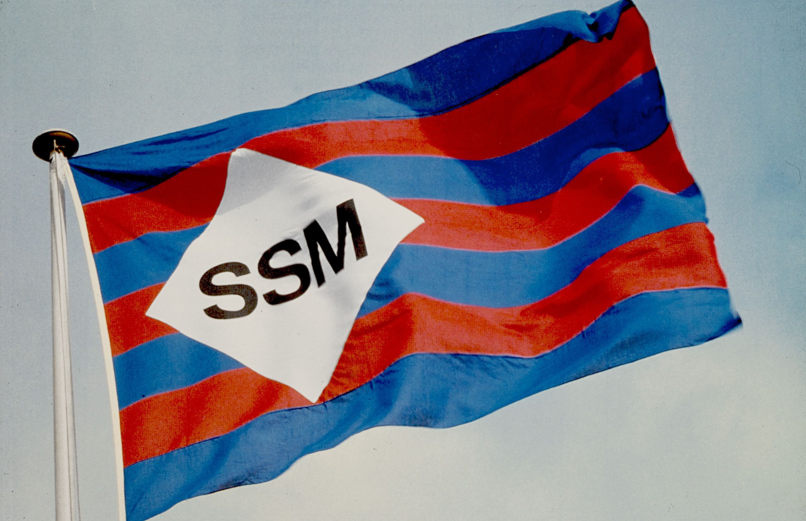 A flag bearing the SSM logo c. 1970.